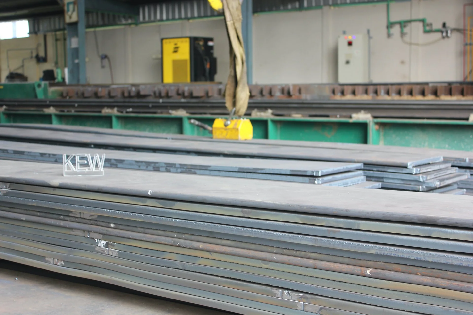 Prepared steel plates in front of KEW workshop machinery