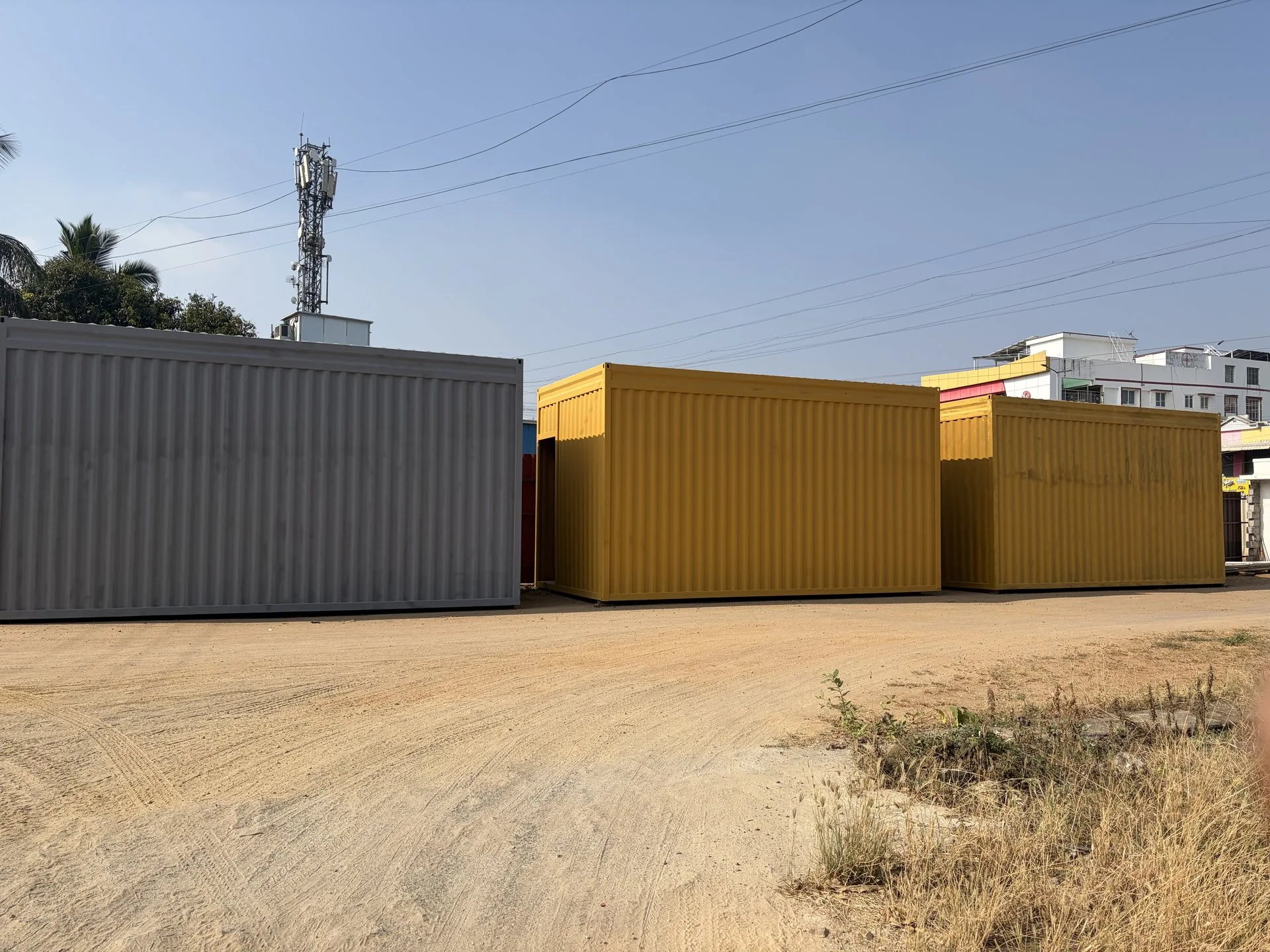 Finished grey and yellow container structures at KEW