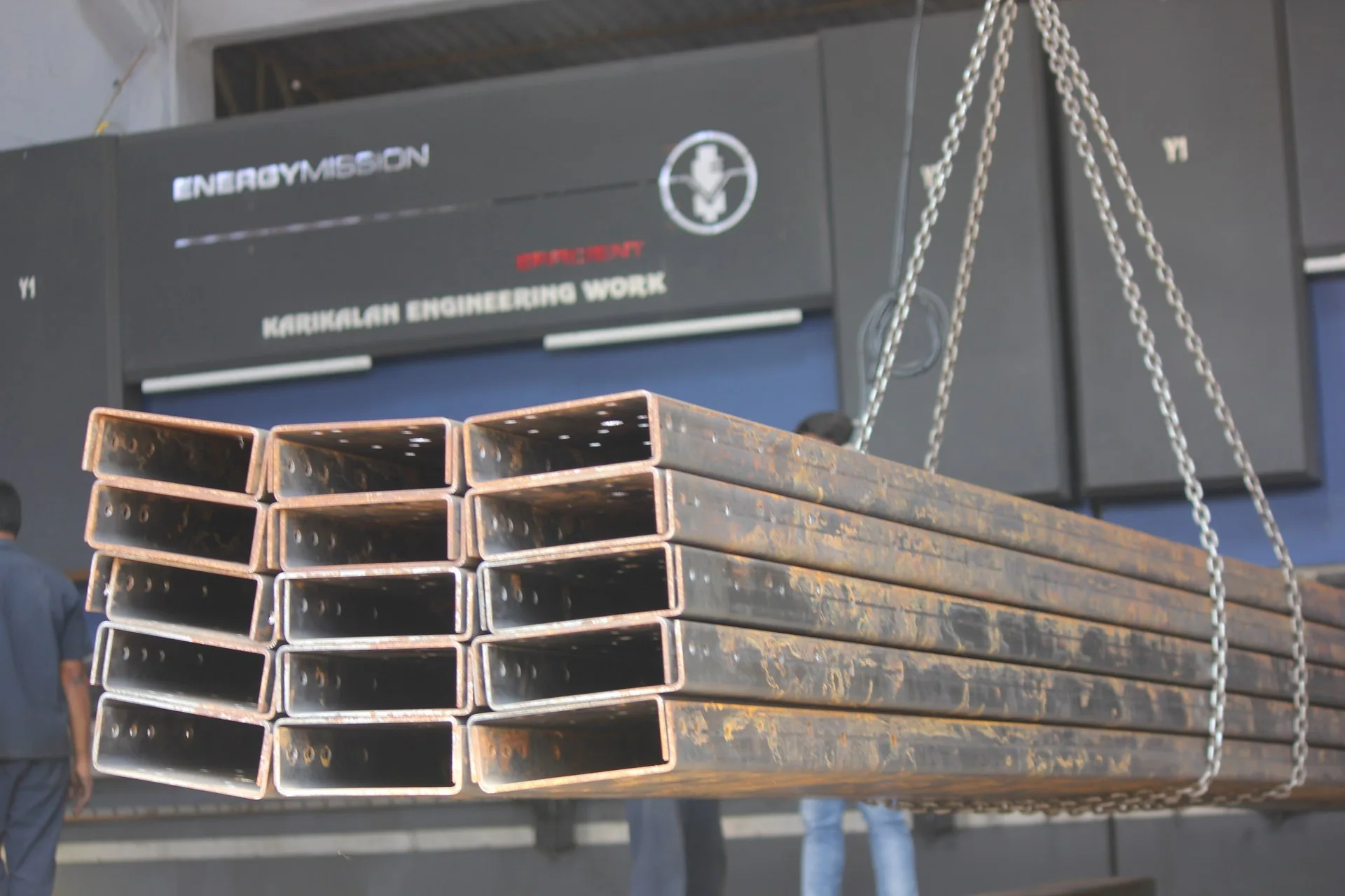 Long rectangular formed steel sections in front of the KEW press brake